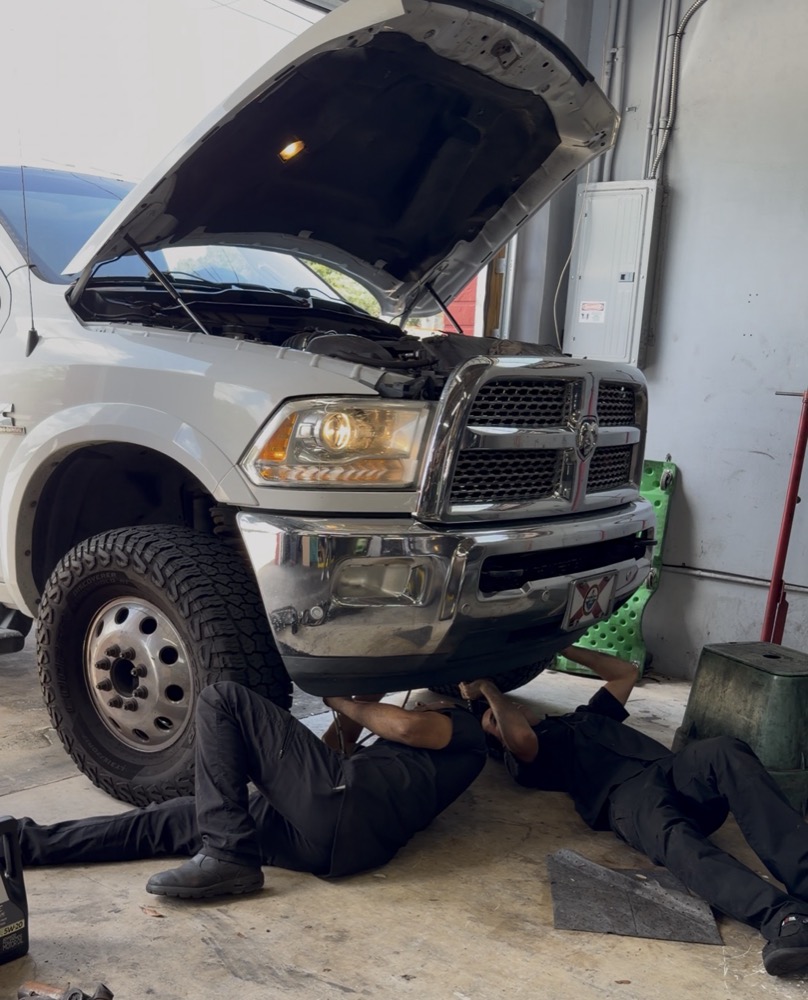 Mechanic working under diesel truck